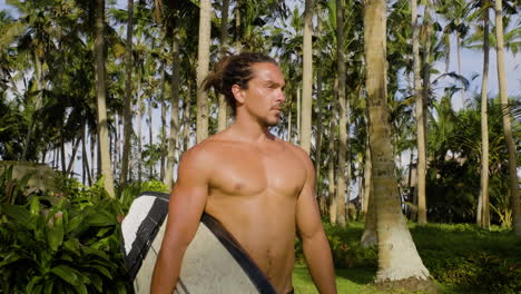 man holding surfboard