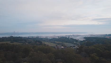 drone view at parque florestal de monsanto with view at lisbon and rio tejo