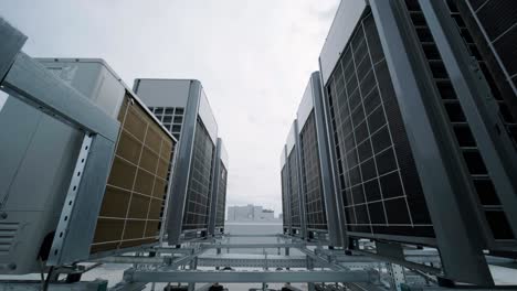 the air conditioning and ventilation system of a large industrial facility is located on the roof. it includes an air conditioner, smoke exhaust, and ventilation.