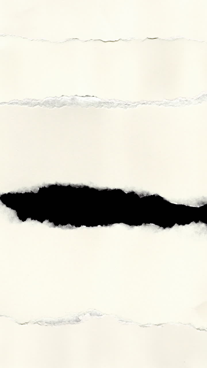 White Paper Tearing Horizontally to Reveal Layers
