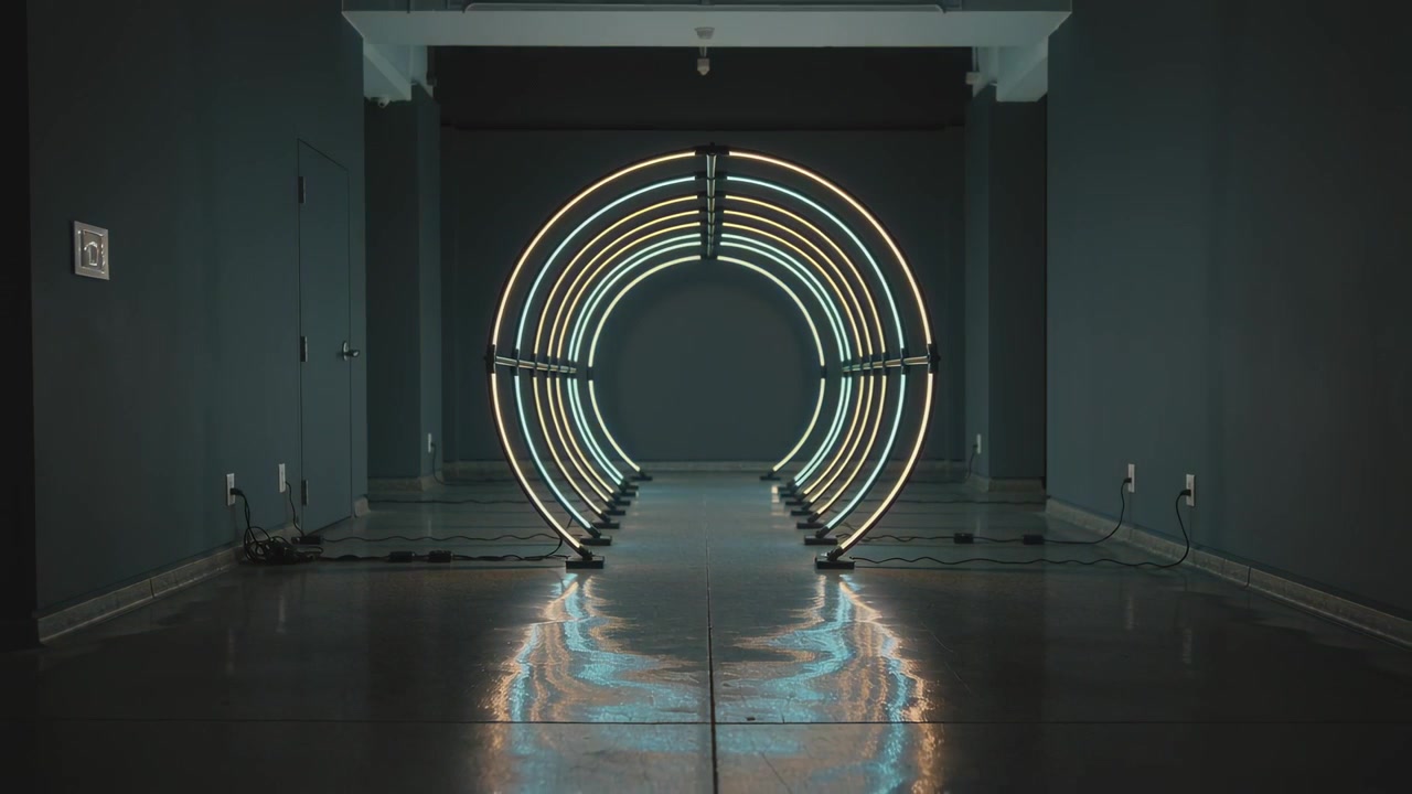 Powering nested ring light art pulsing rings shifting colors in gallery with cables for display