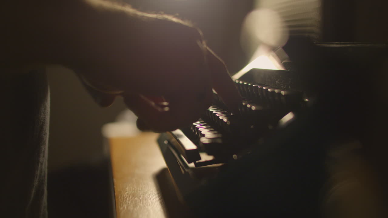 Close Side Shot Of Person Typing On Old Typewriter, Dreamy backlit scene