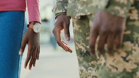 soldier and his girlfriend hands holding hands