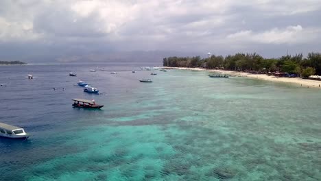 large cloud formation over lombok island
spectacular aerial view flight fly forward drone footage
of gili t beach indonesia at sunny summer 2017