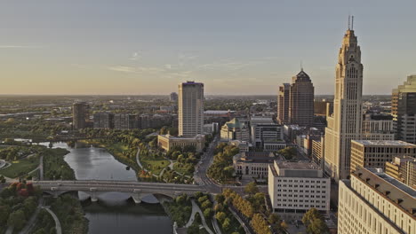 columbus ohio aerial v66 drone flyover scioto river capturing riverfront greenway, discovery bridge, sunset cityscape across arena district and downtown - shot with mavic 3 pro cine - sept 21st 2023