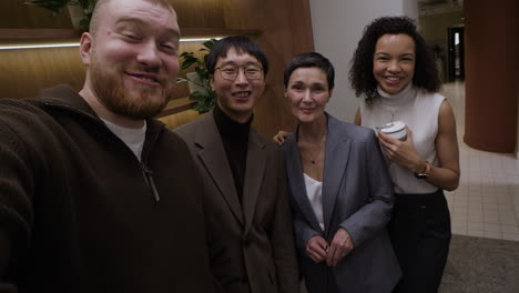 group selfie in a modern office