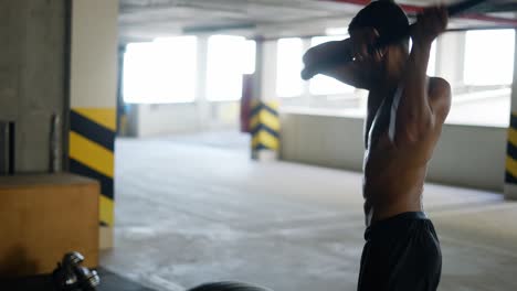 athlete hitting huge tire with sledgehammer