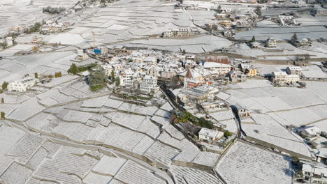 grandvaux village and vineyards covered with snow during winter in lavaux, switzerland