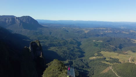 Unrecognizable-tourists-at-viewpoint-admiring-landscape-of-Serra-do-Corvo