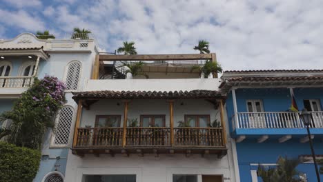 colombian architecture with blue and white colonial houses and wooden balconies in cartagena