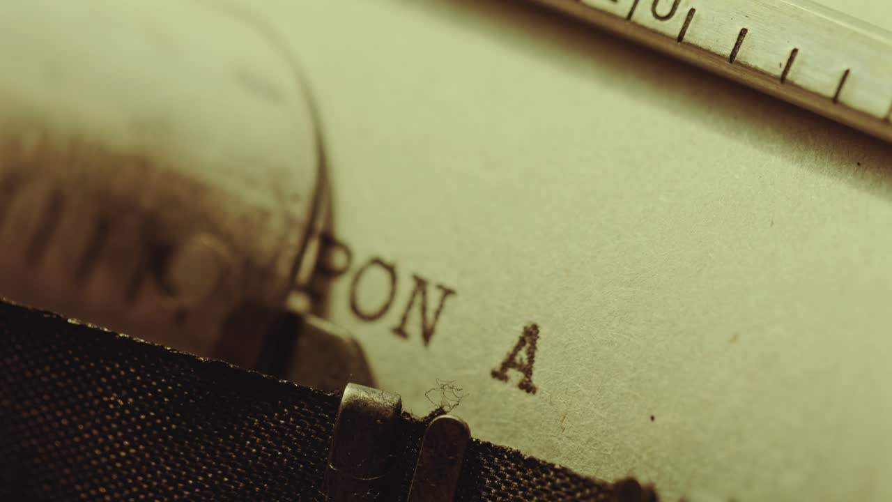 Typing Once Upon a Time on Page of Paper with Typewriter