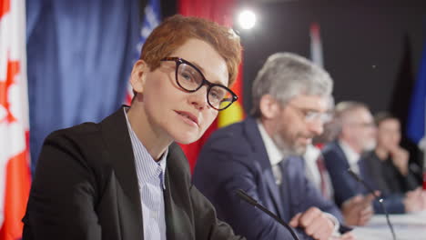 female diplomat giving speech at press conference
