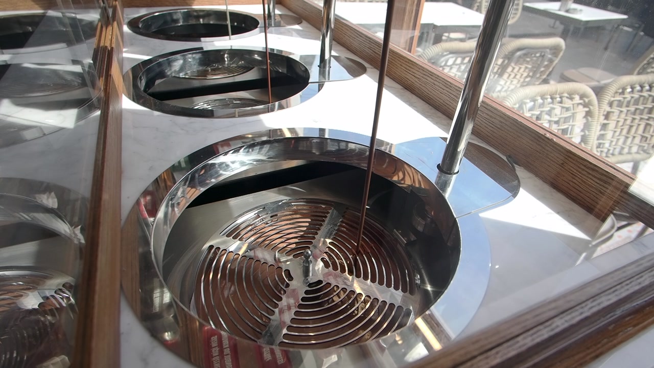 Liquid Chocolate Flowing in a Commercial Tempering Machine