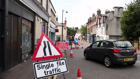 car navigating single file traffic zone