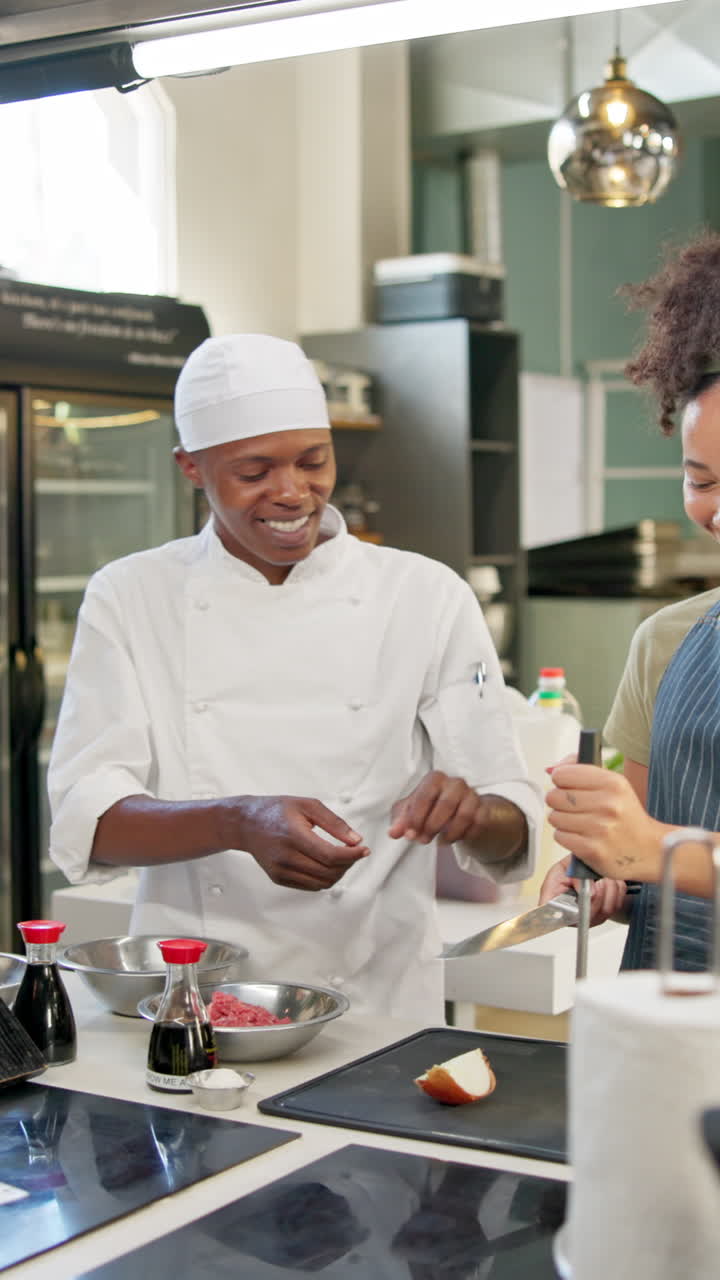 Chefs preparing a meal in a kitchen