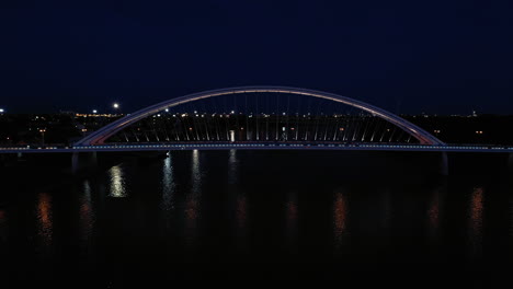 night shot of a modern apollo bridge across river danube in bratislava, slovakia