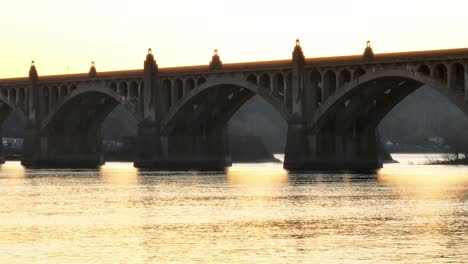 Aerial-wide-shot-showing-historic-bridge-with-arches-connecting-Columbia-and-Wrightsville-in-Pennsylvania,-USA