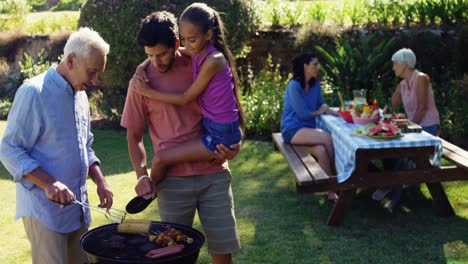 Happy-girl,-father-and-grandfather-preparing-barbecue-4k