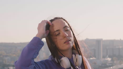 brunette woman on a terrace