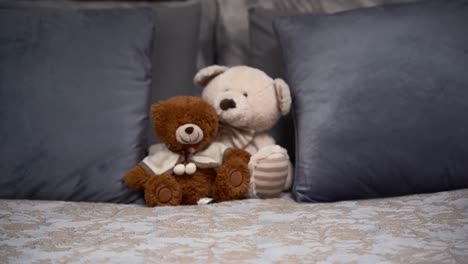 teddy bears on the double, grey bed