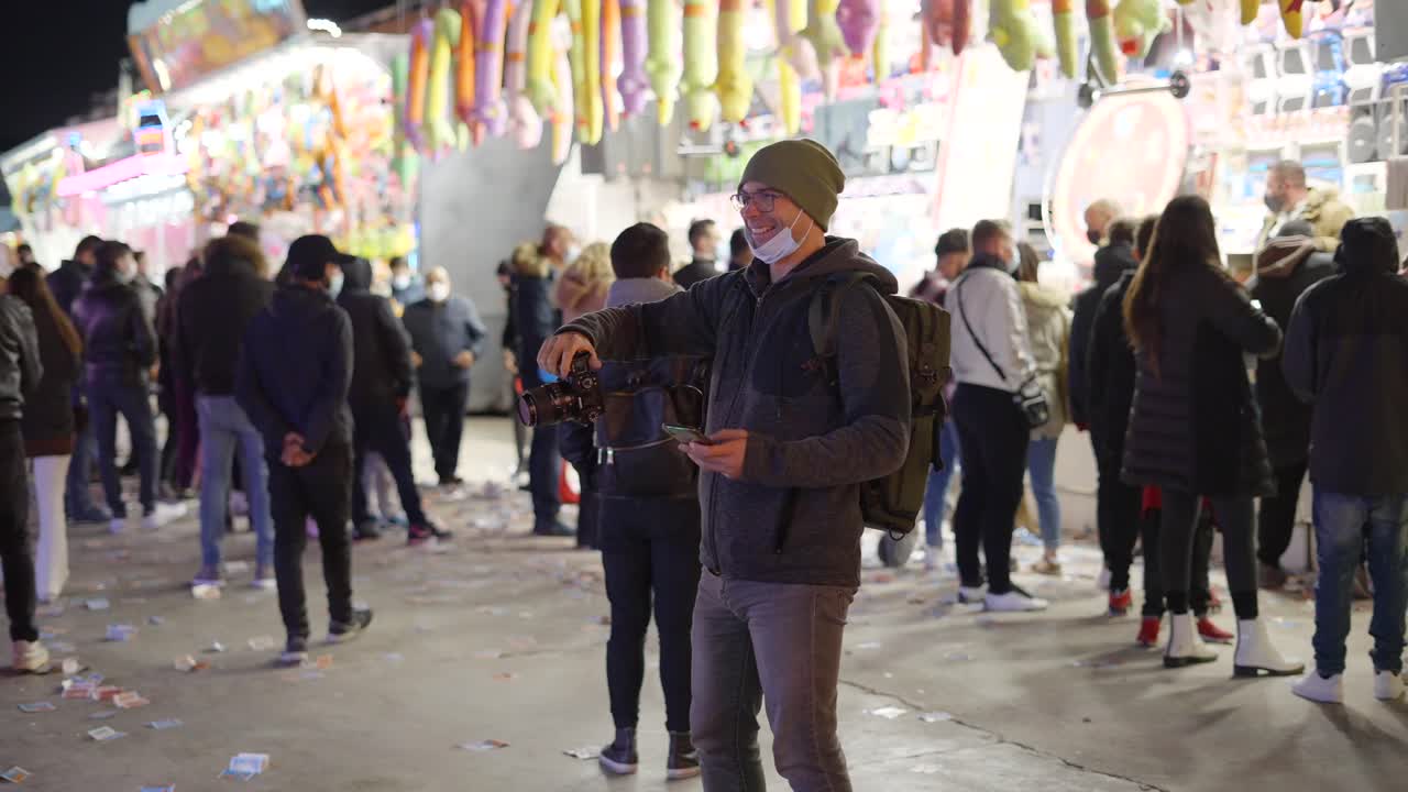 Photographer at a Night Carnival