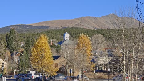 Wide-angle-town-view-of-Breckenridge-with-Bald-Mountain-in-the-distance-and-yellow-colored-aspen-trees