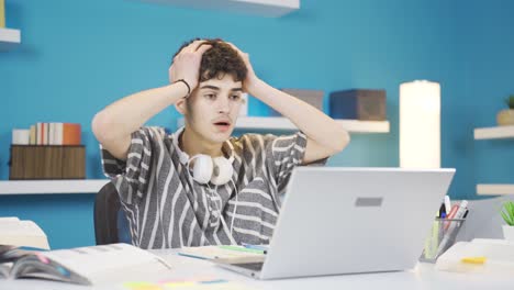 Student-looking-at-laptop-gets-upset.-Negative-exam-results.