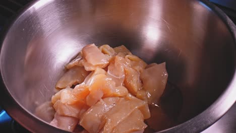 Adding-egg-whites-into-chicken-breast