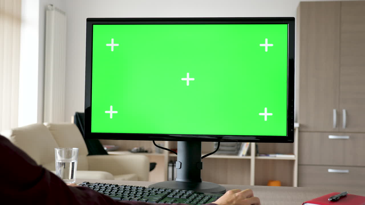 Green screen computer setup in an office environment
