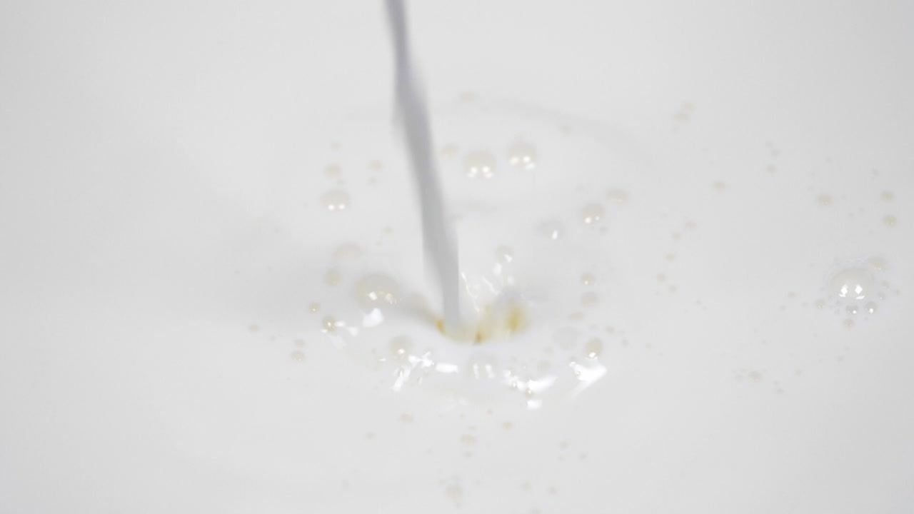 Pouring fresh milk in super slow motion 4k