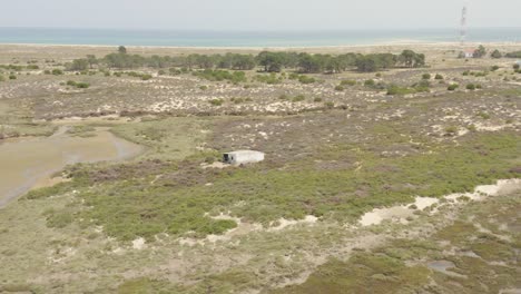 Drone-orbit-shot-of-beachside-of-Armona-Culatra-in-Faro-Island,-Portugal