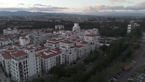 panoramic view of cayalá, an upscale urban development in guatemala city, featuring mediterranean-style white buildings with red roofs.