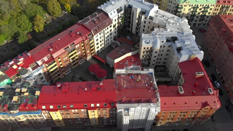 aerial view of colorful buildings forming triangle shaped courtyard