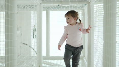 Adorable-Little-Girl-Walking-Inside-the-Rope-Maze-for-Children