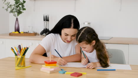 Concentrated-Waitress-Cleaning-Countertop-While-Her-Colleague-Organizing-Glasses-Behind-Her-1