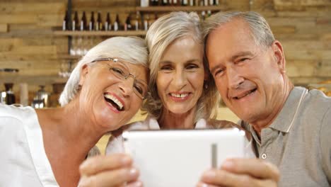 senior friends talking a selfie in cafe 4k