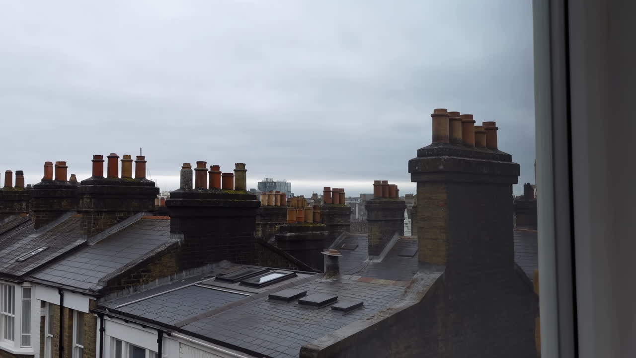 Rooftop View Victorian Chimneys Under Overcast Sky, Gloomy Urban Panorama Framed By Window, Slate Roofs