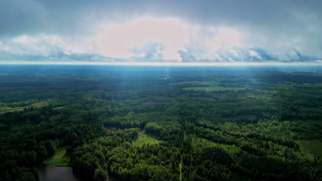 Aerial-View-from-a-Drone-Reveals-the-Countryside's-Radiant-Beauty-with-Sunlight-Casting-Enchanting-Rays-Over-Latvia
