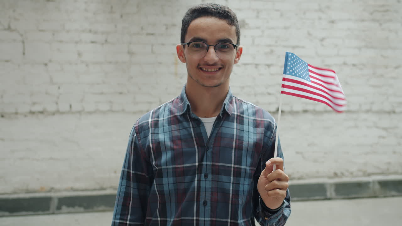 Young Man Holding American Flag
