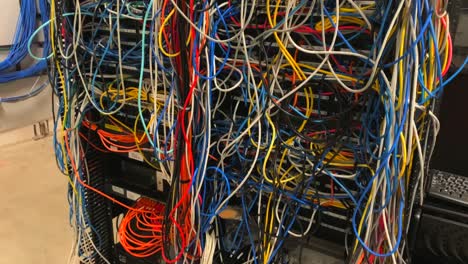 bad terrible comm network closet server rack cable wire management mess