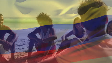 Animación-De-Ondear-La-Bandera-De-Colombia-Sobre-Diversos-Amigos-Que-Pasan-Tiempo-De-Calidad-En-La-Playa