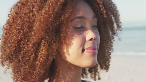 african american woman enjoying the sea view