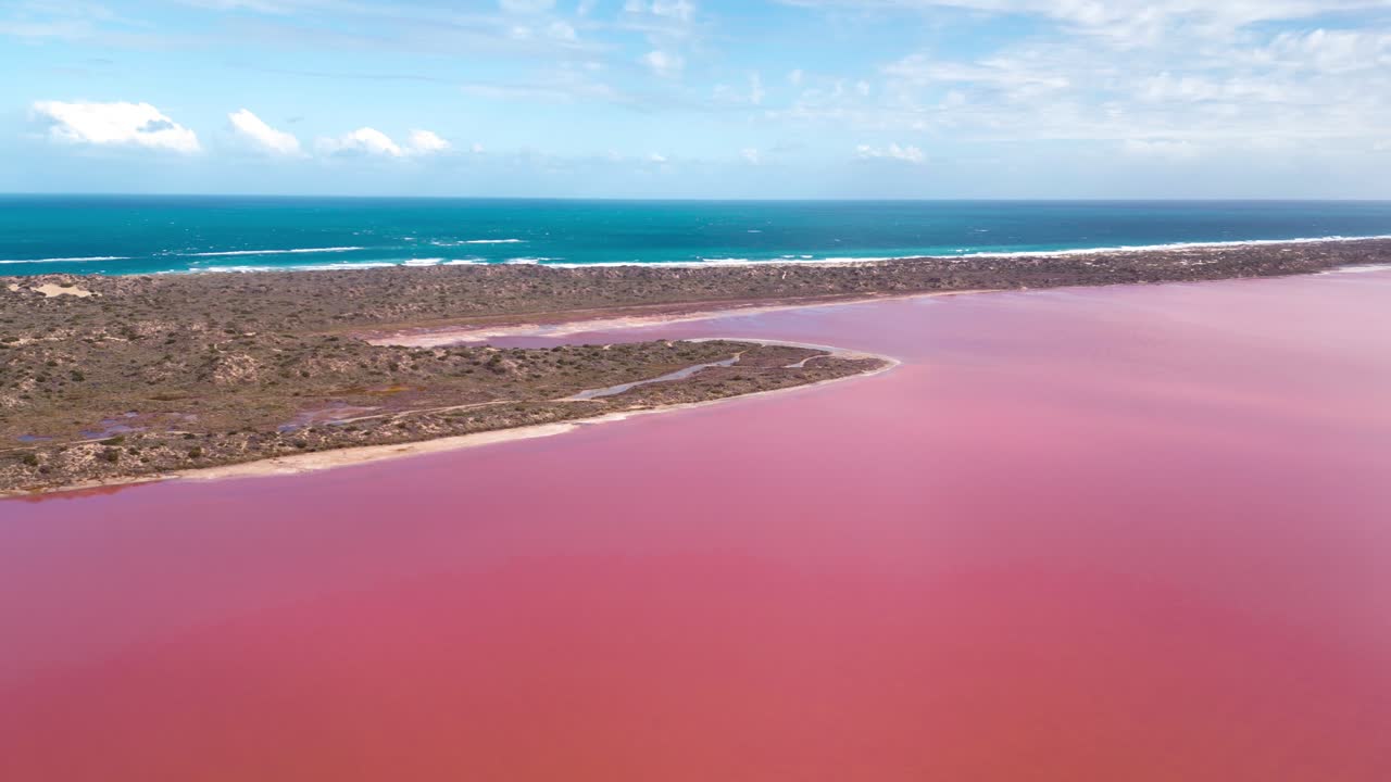 Stunning aerial footage of Perth's Pink Lake, which harmonises with the deep blue skies