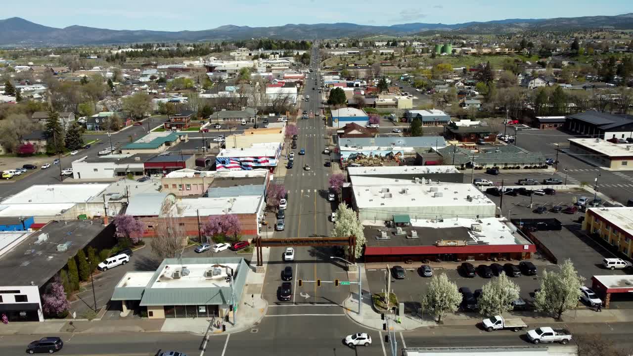 US, Oregon, Prineville, , 2025-04-11 - Drone view showing the downtown and the Prineville sign over the road on a beautiful spring day in central Oregon
