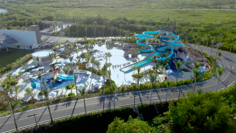 water slide park in tropical resort, luxury family hotel in dominican republic, aerial view of aqua park