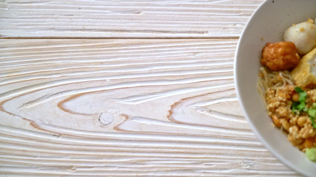 spicy noodles with fish ball and minced pork (Tom Yum Noodles) - Asian food style