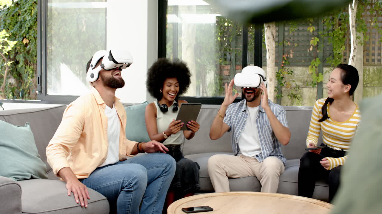 Using VR headsets, young diverse friends enjoying virtual reality experience together