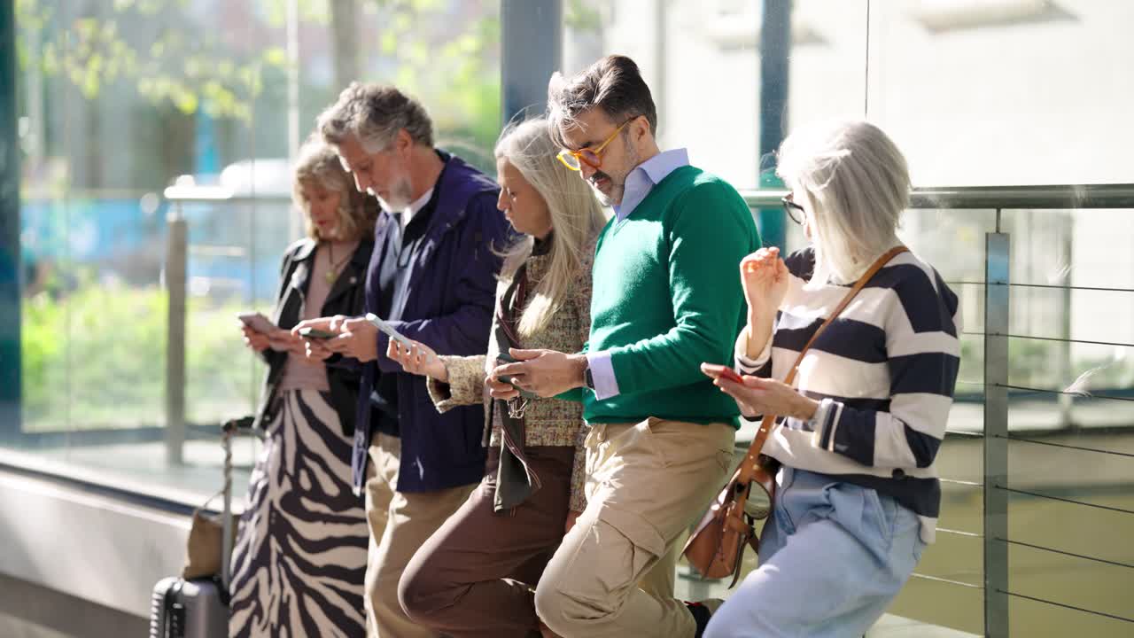 Group of people using cell phones