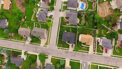 an aerial view of the suburbs during the summer time