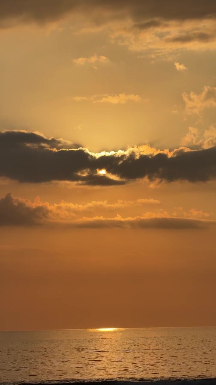 Golden Sunset Over Calm Ocean Waves
